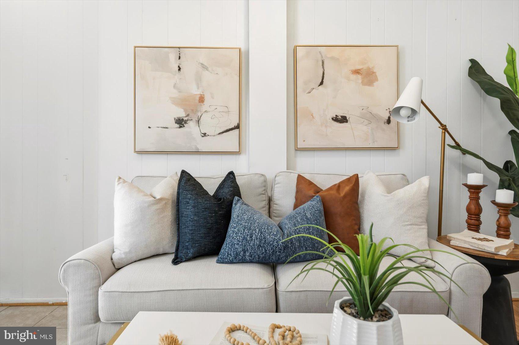 1017 Sterrett Street Baltimore, MD 21230 - Photo 3 of 29 a living room with furniture and painting on the wall
