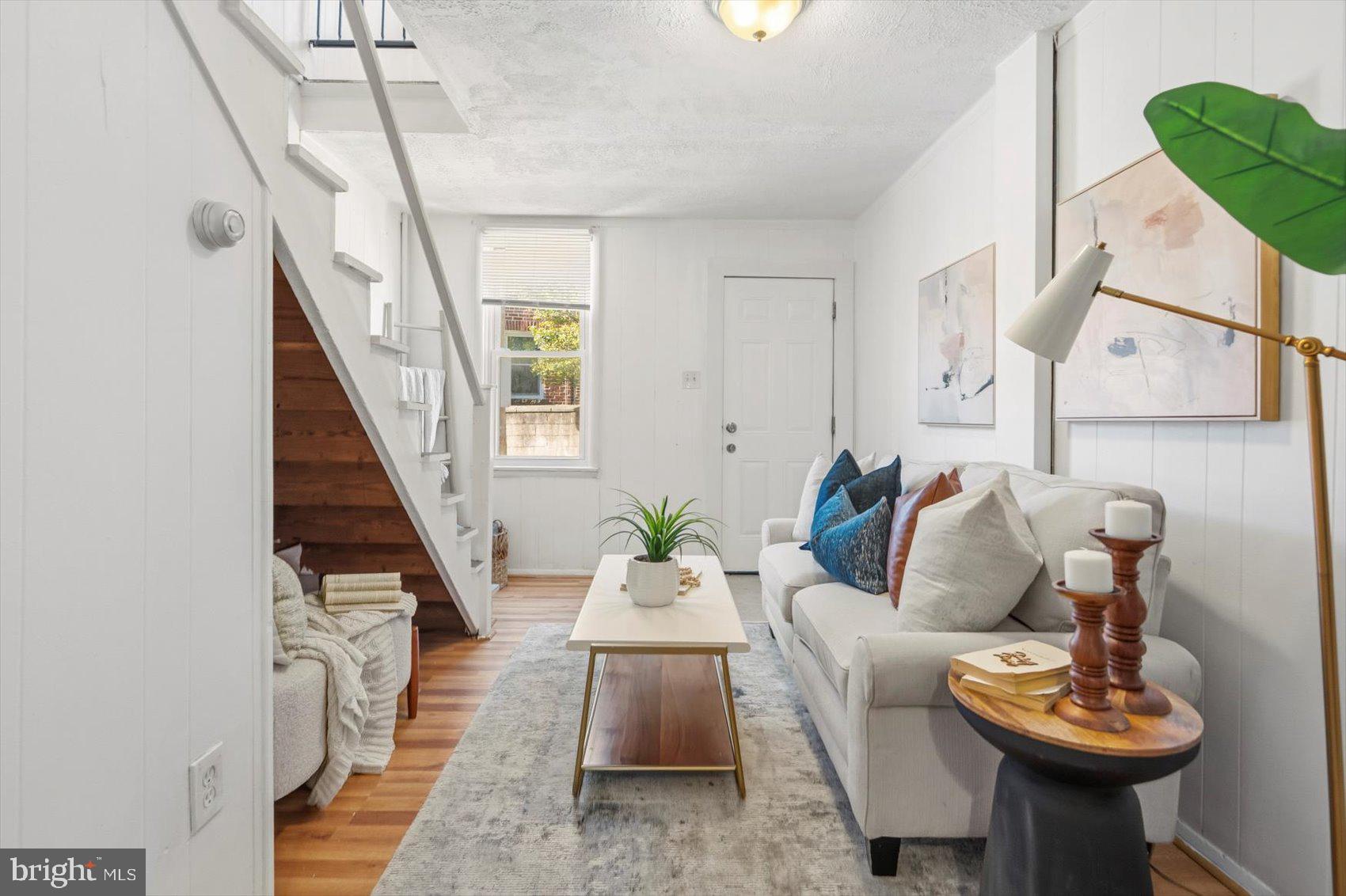 1017 Sterrett Street Baltimore, MD 21230 - Photo 6 of 29 a living room with furniture and a wooden floor