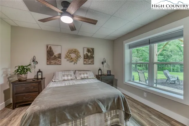 a bedroom with a large bed and a large window