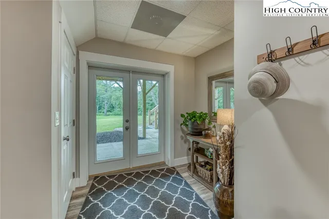 a view of a livingroom with furniture and front door