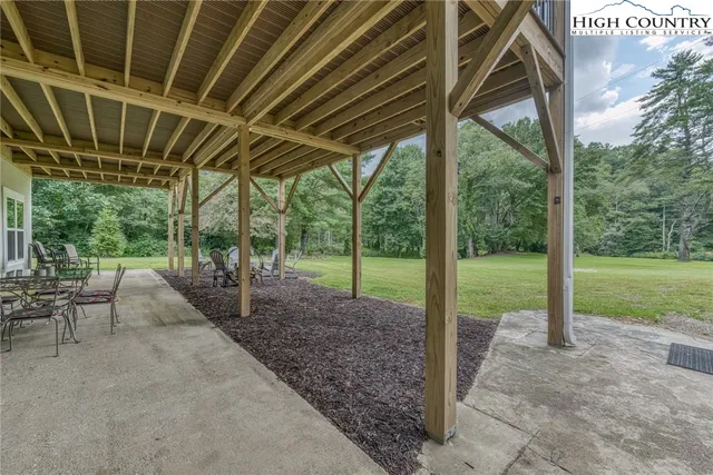 a view of porch with green space
