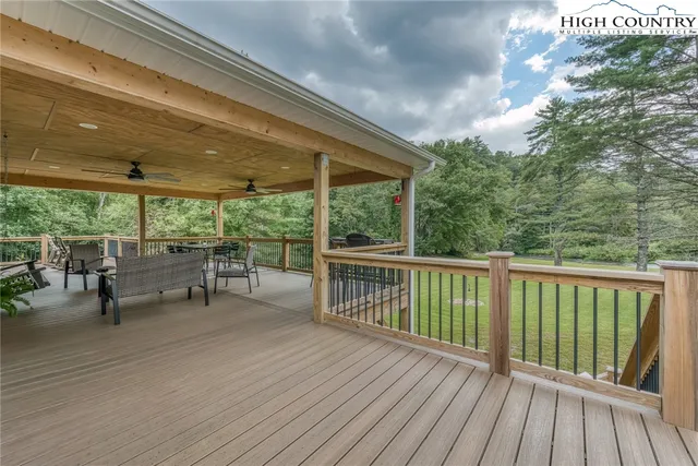 a view of a chairs and table in the balcony