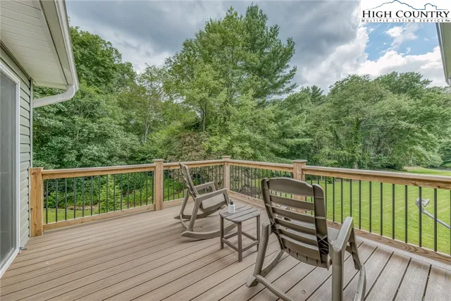 a view of a balcony with furniture