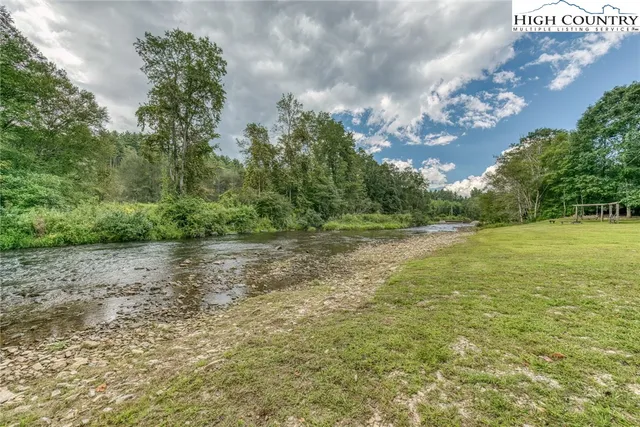 a view of a field with an trees