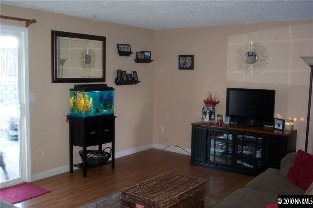 14035 Perlite Drive Reno, NV 89521 - Photo 2 of 5 a living room with furniture and a flat screen tv