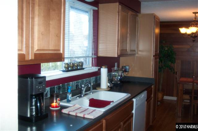 14035 Perlite Drive Reno, NV 89521 - Photo 3 of 5 a kitchen with a refrigerator and sink