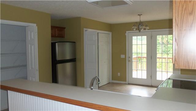 485 Berry Circle Springfield, TN 37172 - Photo 5 of 7 a view of an empty room and window and chandelier