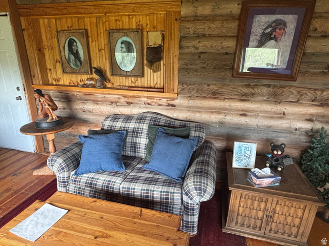 6476 Stauffer Road, Unit 4 Montpelier, ID 83254 - Photo 13 of 17 Log cabin interior featuring robust log walls and wood-finish flooring
