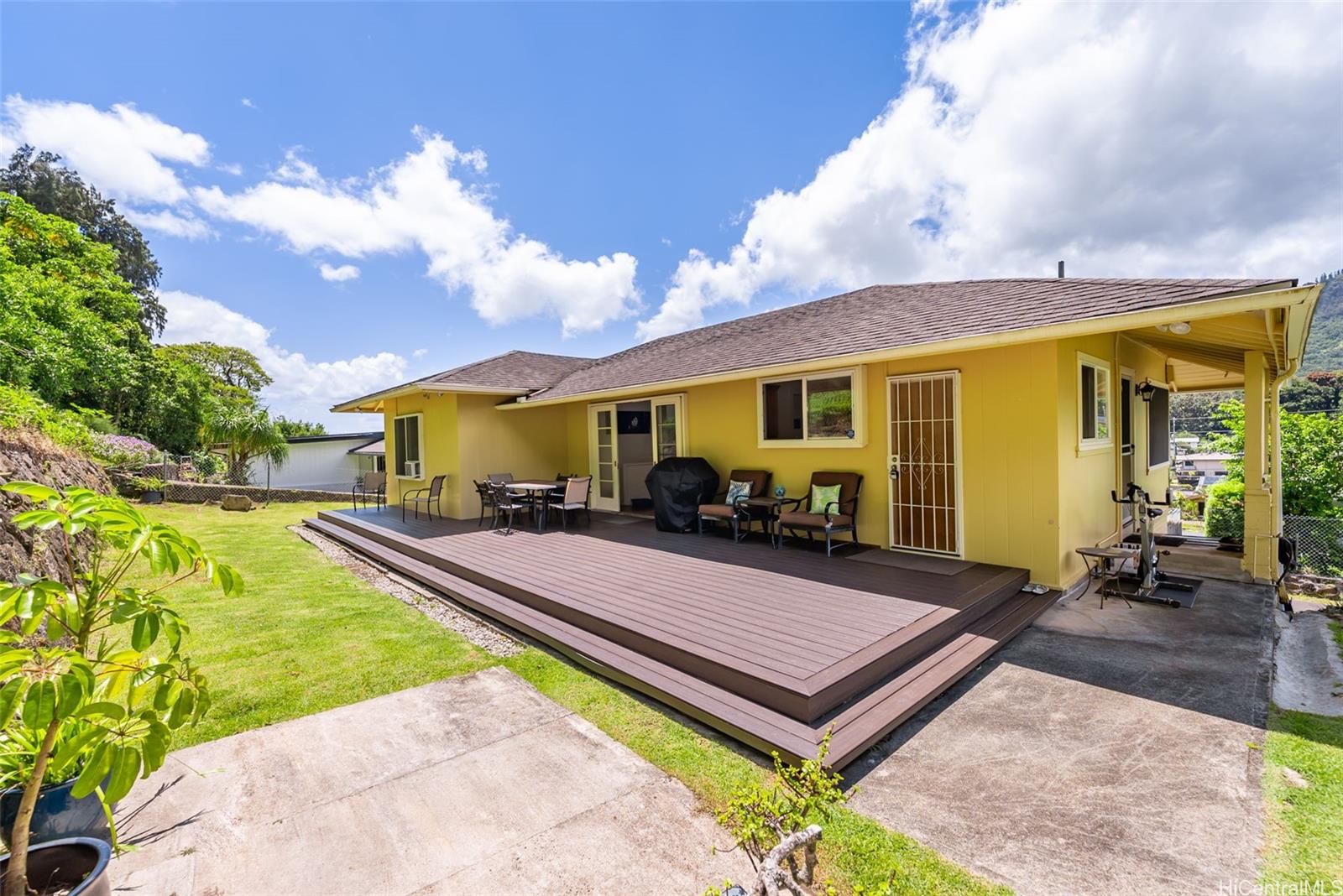 2811 Henry Street Honolulu, HI 96817 - Photo 7 of 25 Imagine summer barbecues and peaceful evenings on this magnificent back deck that extends your living space right out into the beautiful, grassy yard