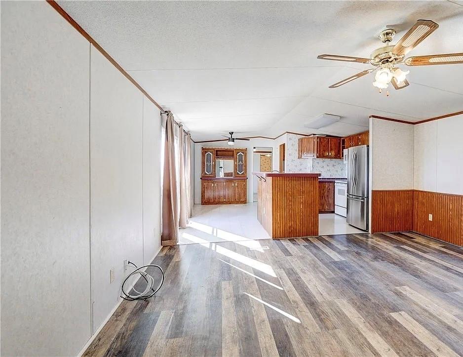 3697 Fm 2808 Road Kempner, TX 76539 - Photo 3 of 18 a view of a room with wooden floor and windows
