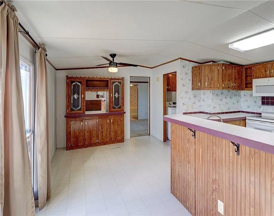 3697 Fm 2808 Road Kempner, TX 76539 - Photo 5 of 18 a view of a kitchen with a sink and cabinets