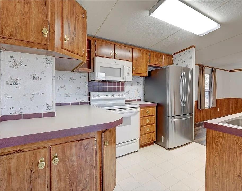3697 Fm 2808 Road Kempner, TX 76539 - Photo 7 of 18 a kitchen with stainless steel appliances a refrigerator and a stove top oven