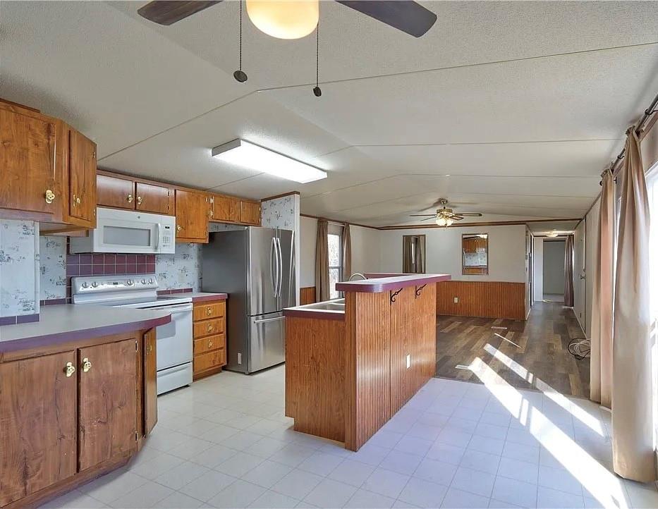 3697 Fm 2808 Road Kempner, TX 76539 - Photo 8 of 18 a kitchen with stainless steel appliances granite countertop a sink and cabinets