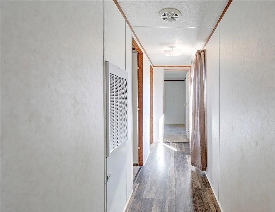 3697 Fm 2808 Road Kempner, TX 76539 - Photo 9 of 18 a view of a hallway with wooden floor and staircase
