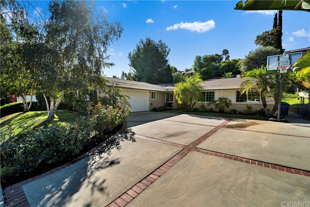 4059 Magna Carta Road Calabasas, CA 91302 - Photo 1 of 1 a front view of a house with garden