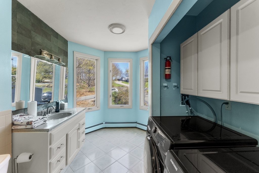 43 Farina Road Hull, MA 02045 - Photo 23 of 39 a kitchen with granite countertop a sink and a stove top oven