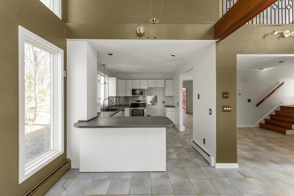 43 Farina Road Hull, MA 02045 - Photo 10 of 39 a view of kitchen with stainless steel appliances granite countertop a sink and a refrigerator