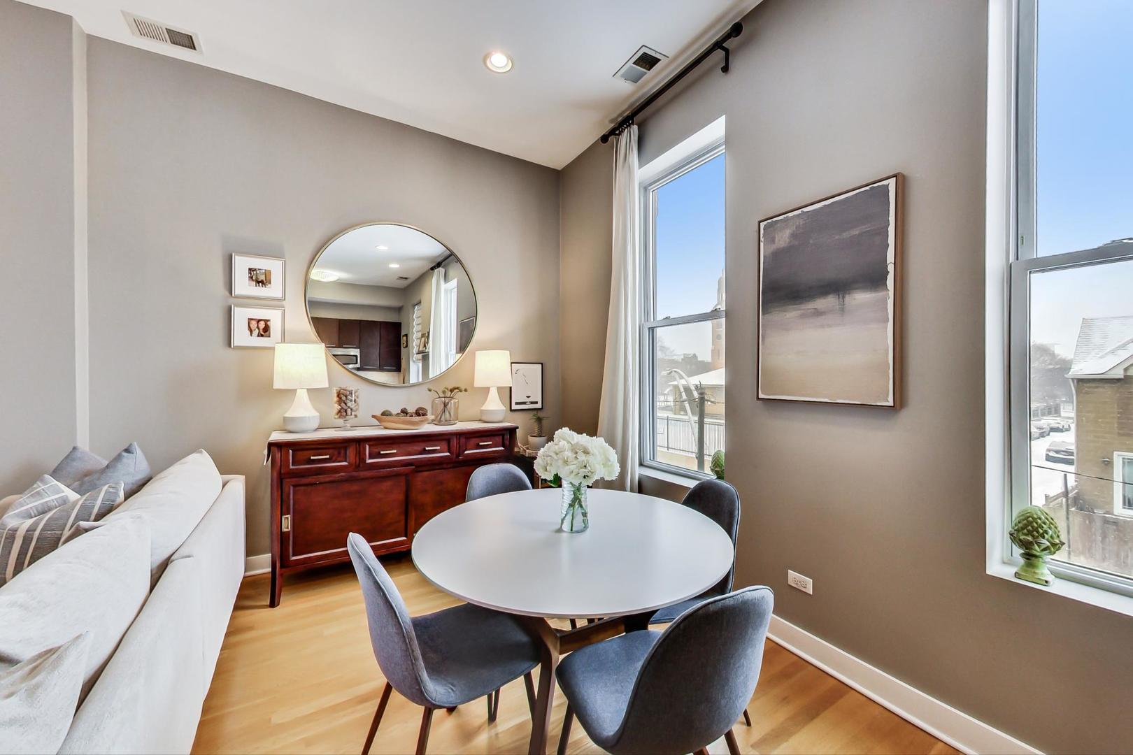 1256 North Cleaver Street, Unit 2E Chicago, IL 60642 - Photo 4 of 18 a dining room with furniture and window