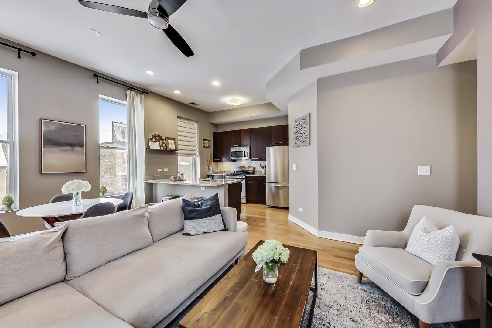 1256 North Cleaver Street, Unit 2E Chicago, IL 60642 - Photo 5 of 18 a living room with furniture and a view of kitchen