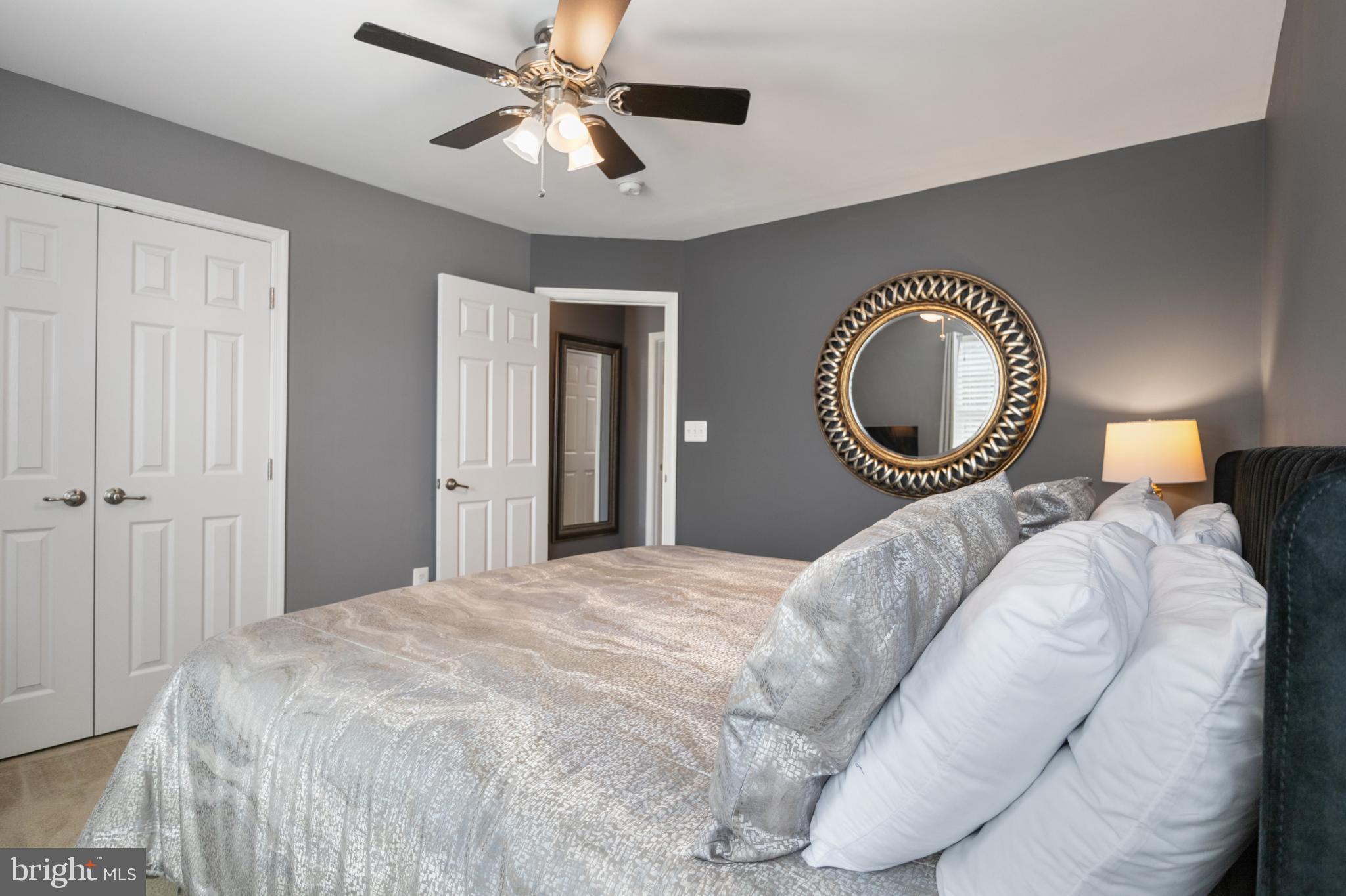 856 Countryside Road Seven Valleys, PA 17360 - Photo 18 of 47 a bedroom with a bed and a chandelier