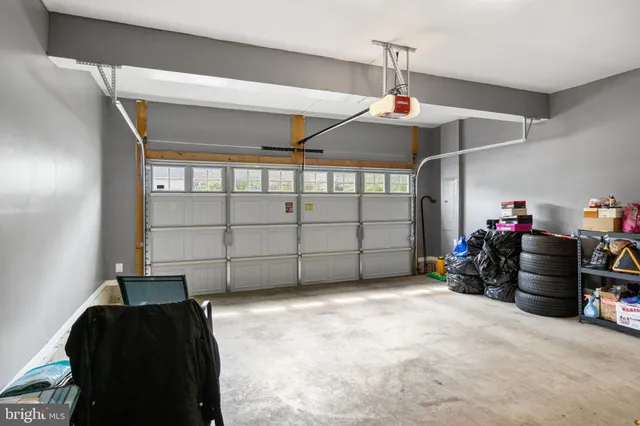 a view of a garage with rack and bicycle