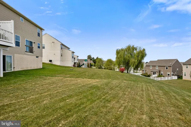 a house view with a big yard