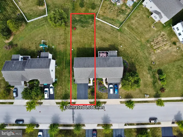 an aerial view of houses with trees