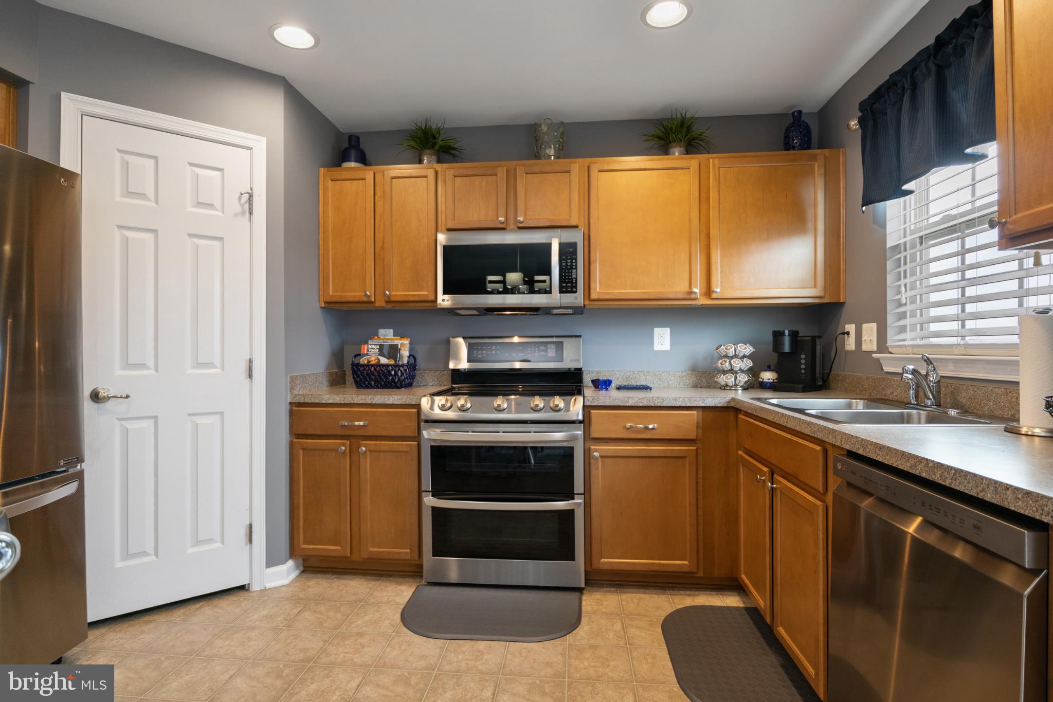 856 Countryside Road Seven Valleys, PA 17360 - Photo 9 of 47 a kitchen with a sink stove and microwave