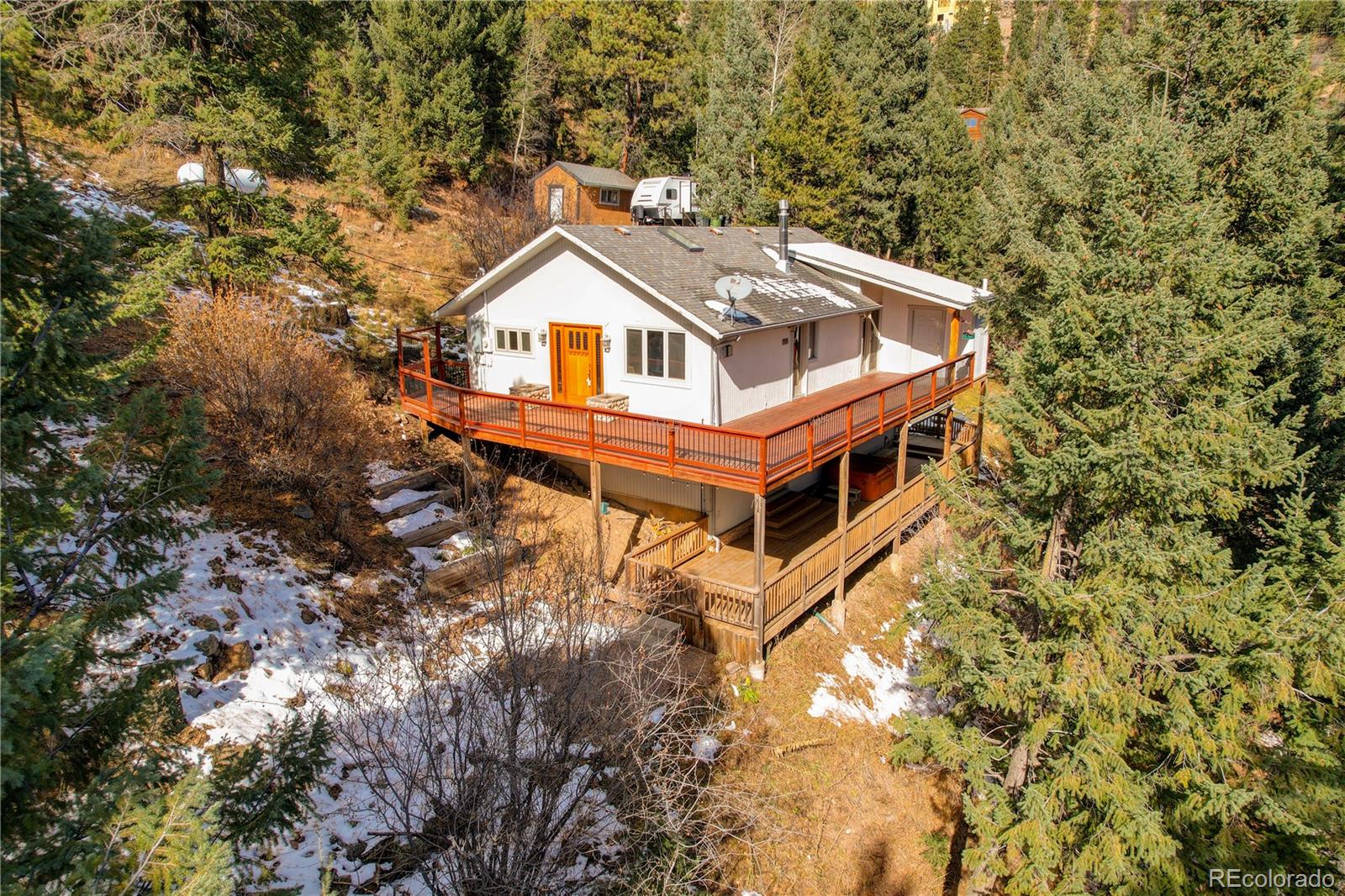 32856 Timber Ridge Road Evergreen, CO 80439 - Photo 1 of 41 a front view of a house with a yard