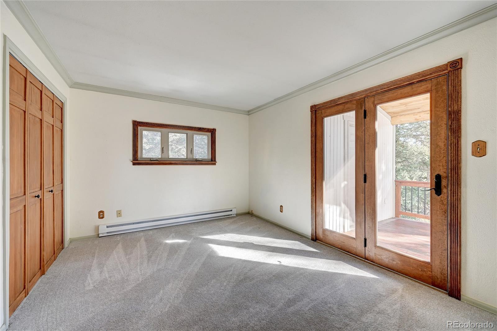 32856 Timber Ridge Road Evergreen, CO 80439 - Photo 13 of 41 an empty room with windows