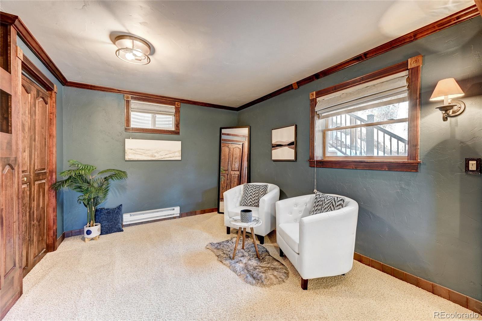 32856 Timber Ridge Road Evergreen, CO 80439 - Photo 25 of 41 a living room with furniture a window and a potted plant