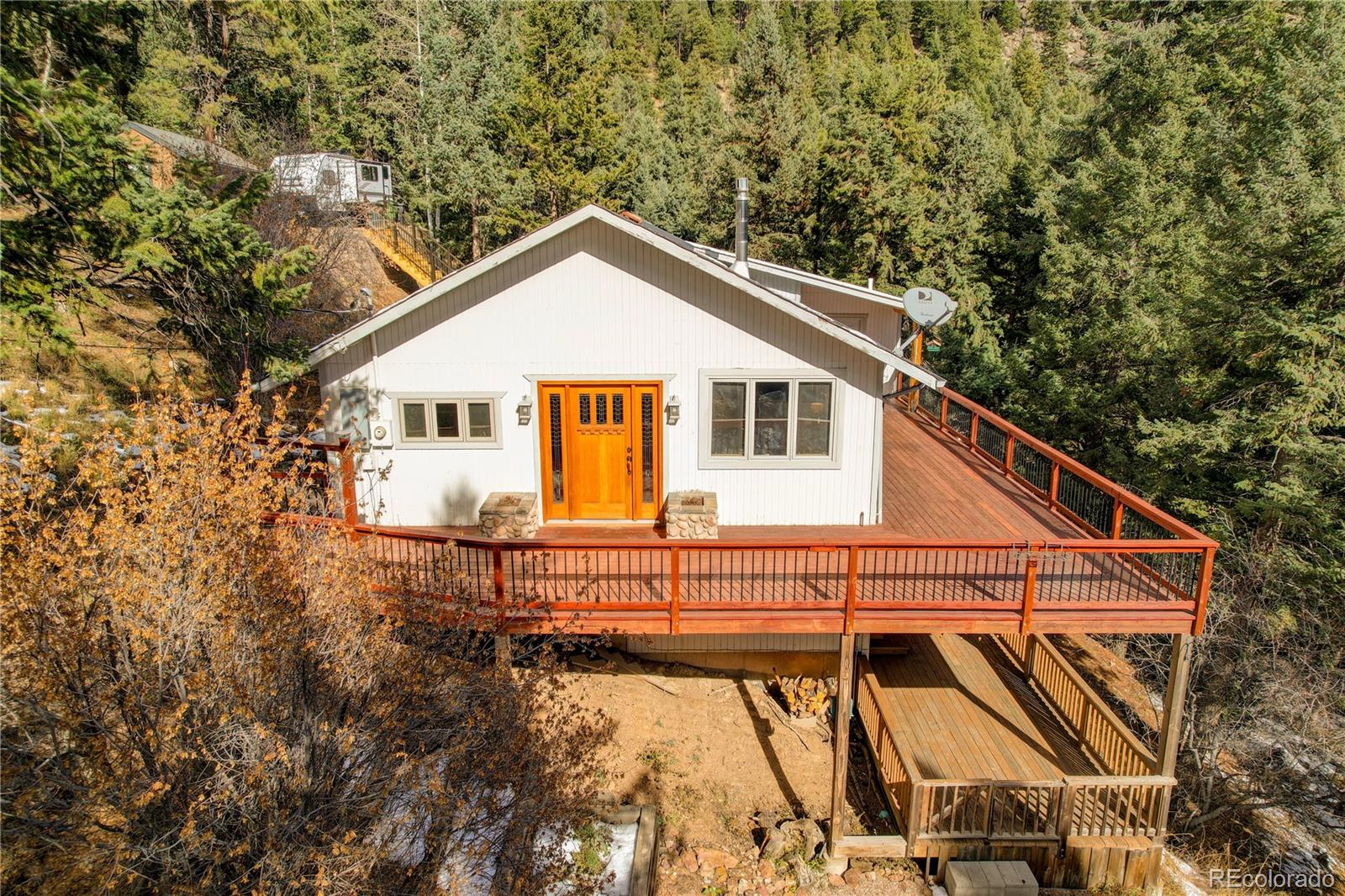 32856 Timber Ridge Road Evergreen, CO 80439 - Photo 3 of 41 a view of a house with backyard