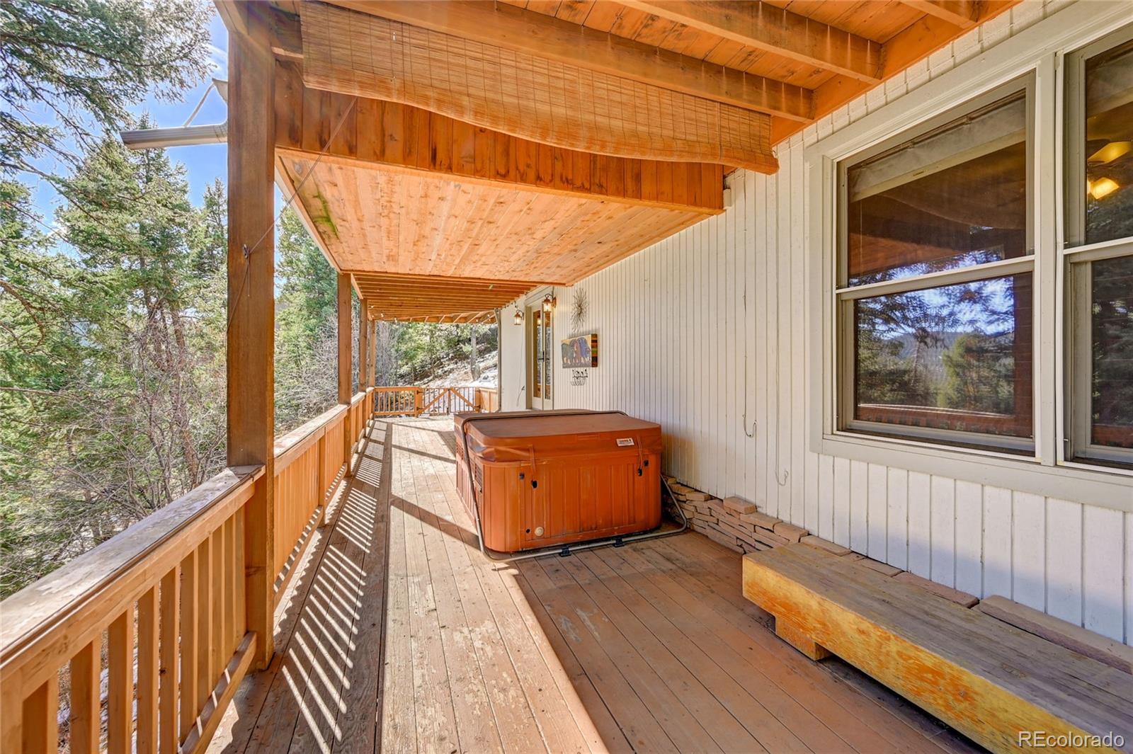 32856 Timber Ridge Road Evergreen, CO 80439 - Photo 33 of 41 a balcony with wooden floor and outdoor space