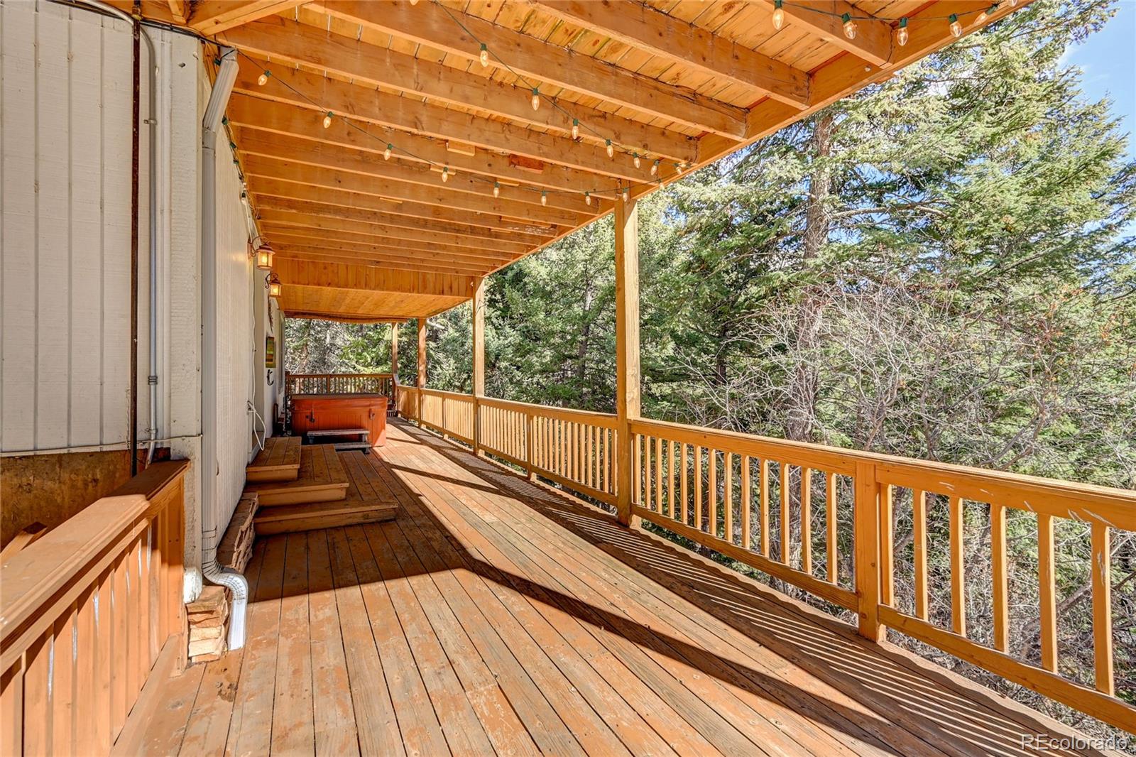 32856 Timber Ridge Road Evergreen, CO 80439 - Photo 34 of 41 a view of balcony with wooden floor