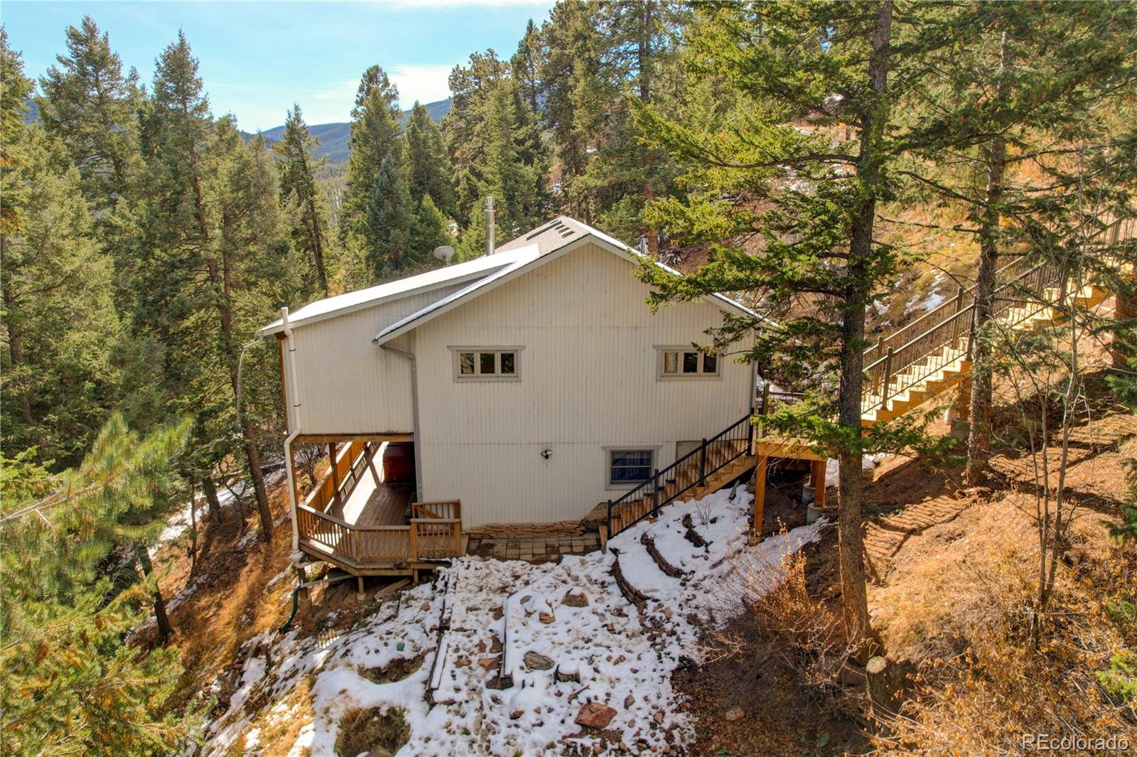 32856 Timber Ridge Road Evergreen, CO 80439 - Photo 37 of 41 a aerial view of a house with large trees