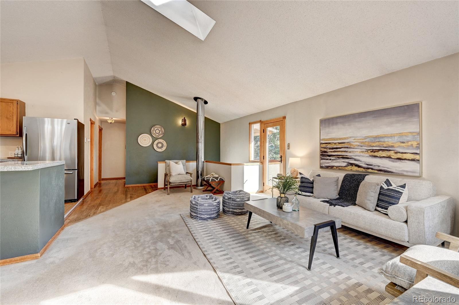 32856 Timber Ridge Road Evergreen, CO 80439 - Photo 4 of 41 a living room with furniture and a large window