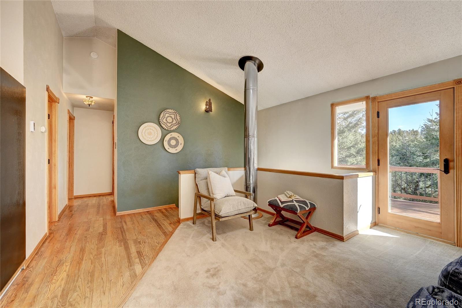 32856 Timber Ridge Road Evergreen, CO 80439 - Photo 6 of 41 a living room with furniture and a window