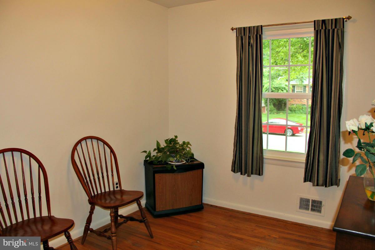 1931 Foxhall Road McLean, VA 22101 - Photo 11 of 21 a view of a chair in wooden floor