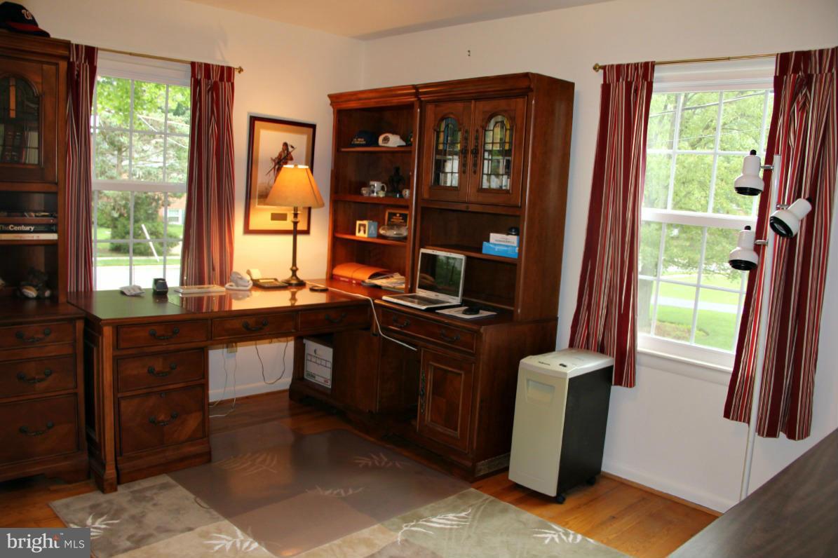 1931 Foxhall Road McLean, VA 22101 - Photo 12 of 21 a view of a workspace with furniture and a window