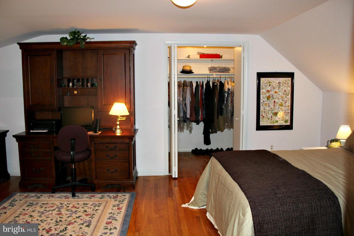 1931 Foxhall Road McLean, VA 22101 - Photo 13 of 21 a bedroom with a bed and wooden floor