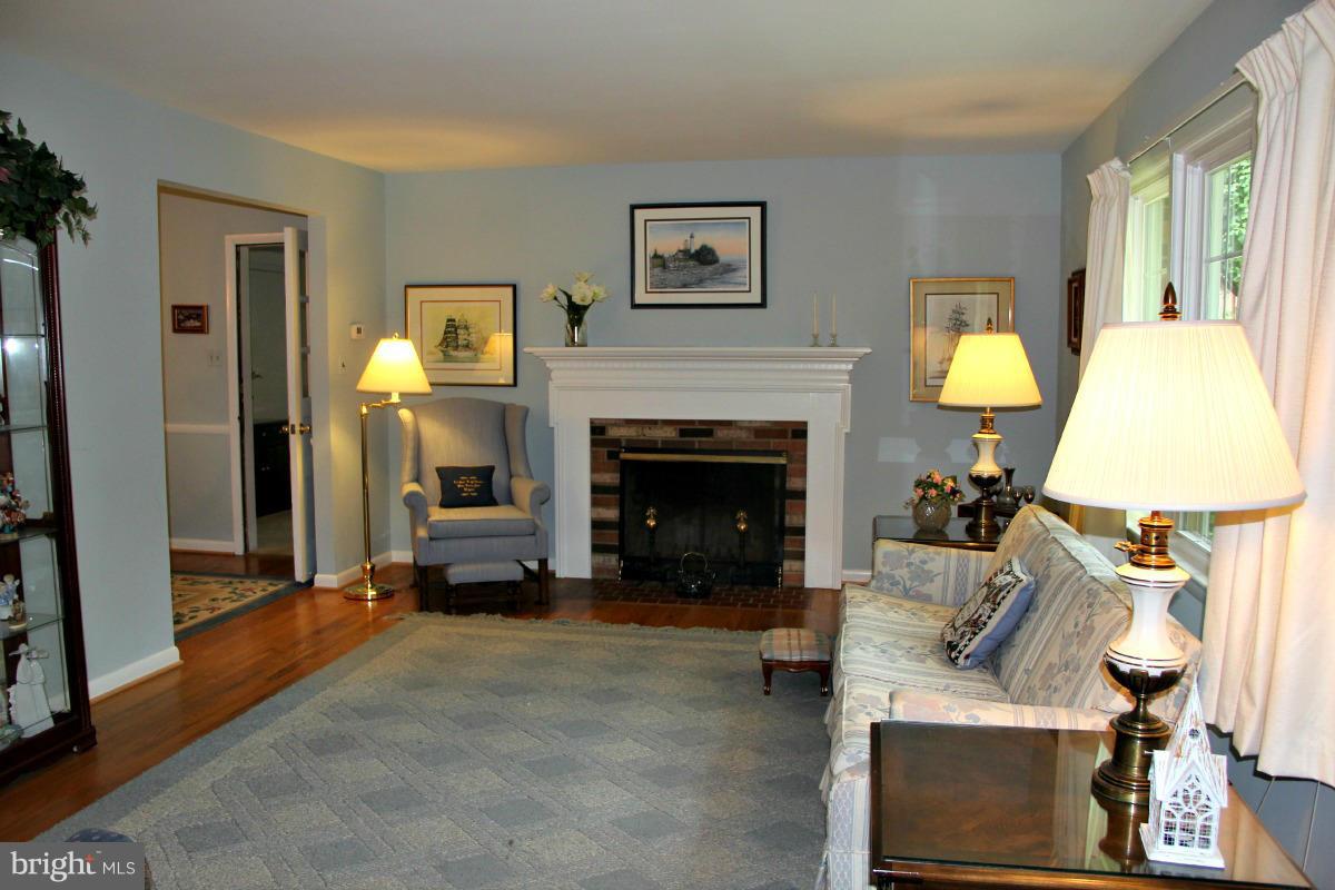 1931 Foxhall Road McLean, VA 22101 - Photo 3 of 21 a living room with furniture and a fireplace