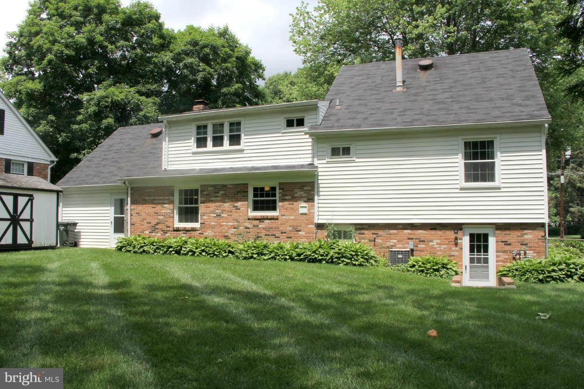 1931 Foxhall Road McLean, VA 22101 - Photo 21 of 21 a front view of a house with a garden