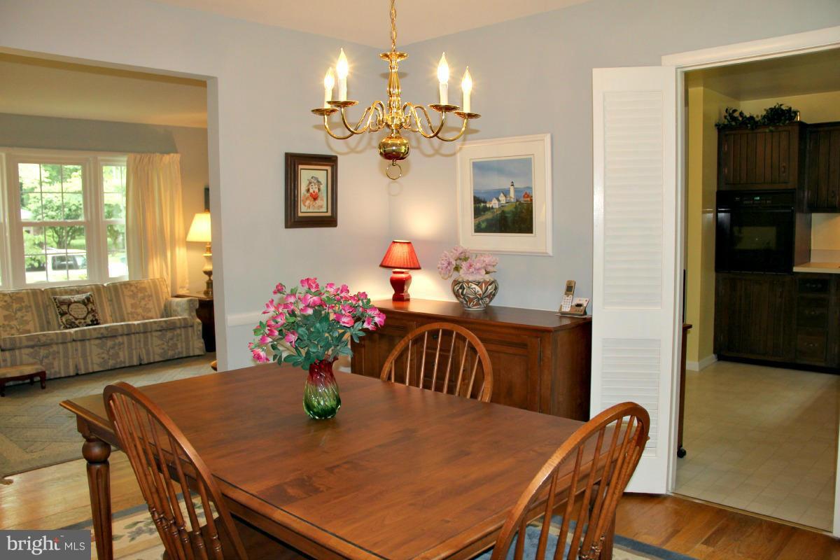 1931 Foxhall Road McLean, VA 22101 - Photo 6 of 21 a view of a dining room with furniture and chandelier