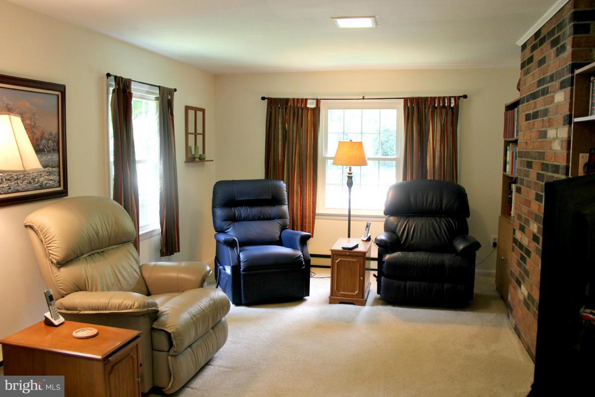 1931 Foxhall Road McLean, VA 22101 - Photo 9 of 21 a living room with furniture and a flat screen tv