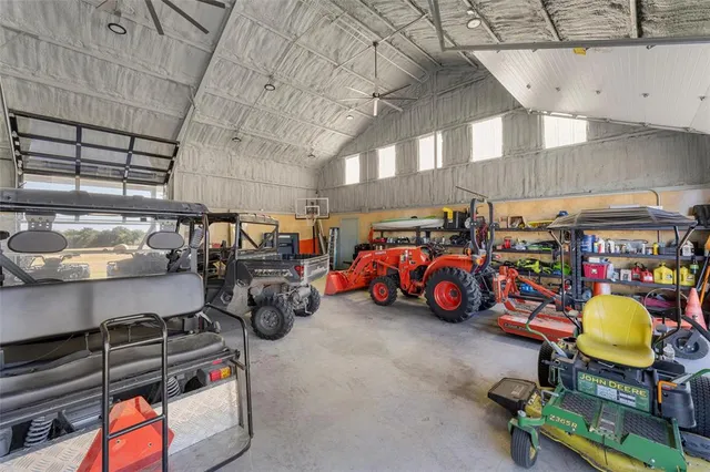 a view of a yard with wooden fence