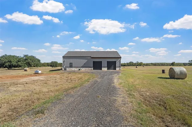 a front view of a house with yard and seating area