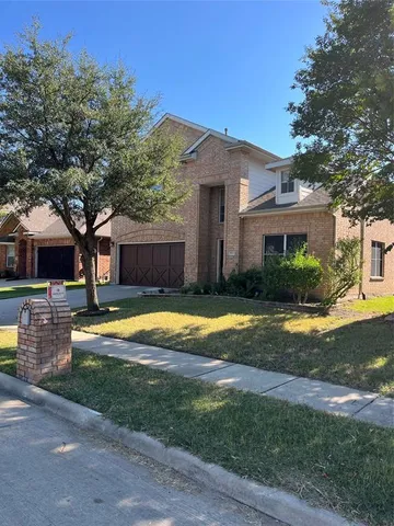 a view of a house with swimming pool and a yard