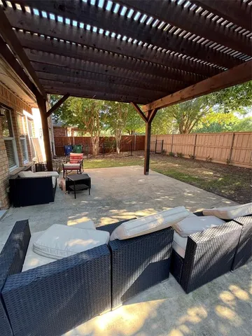 a outdoor living space with patio furniture and a garden