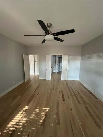 a kitchen with a refrigerator and a sink