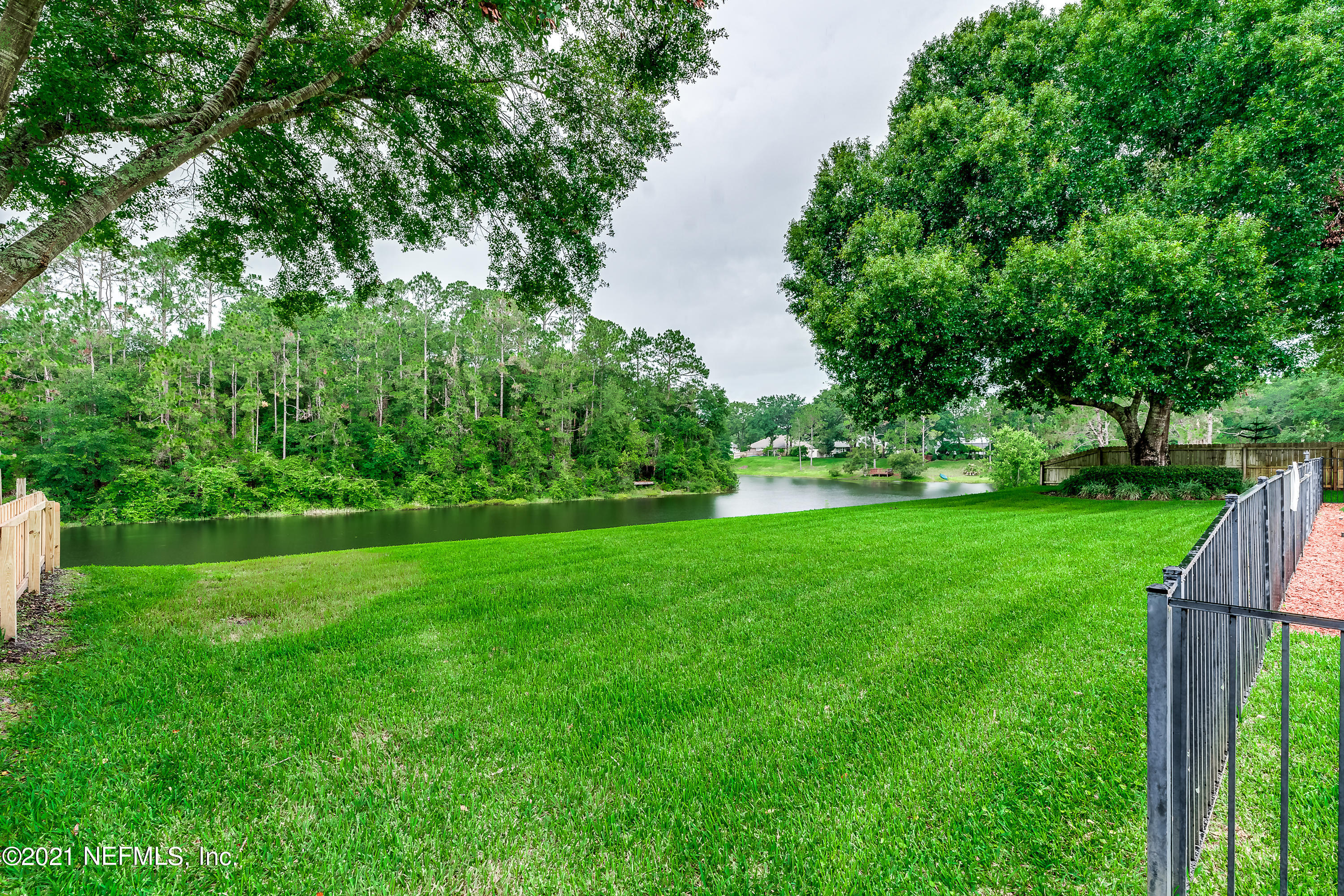 1006 Cactus Cut Road Middleburg, FL 32068 - Photo 26 of 69 a view of green field with trees in the background